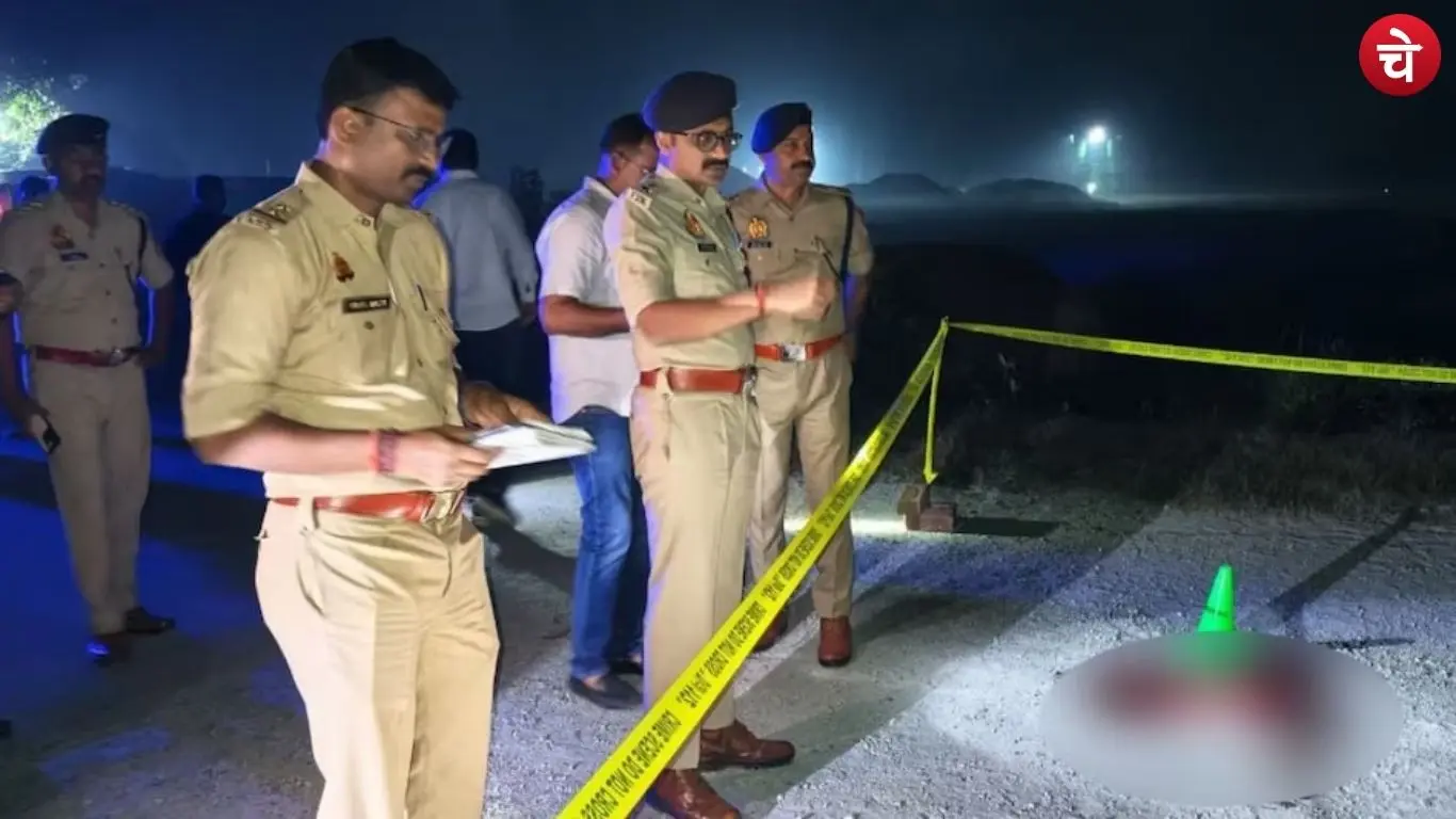 Police investigating at the scene following the murder of two youths in Deoria